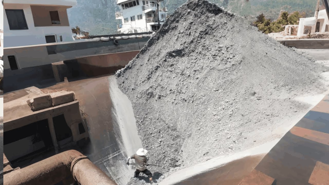 The process of unloading sand and gravel from a barge  Smooth process  First plank  Relaxing video