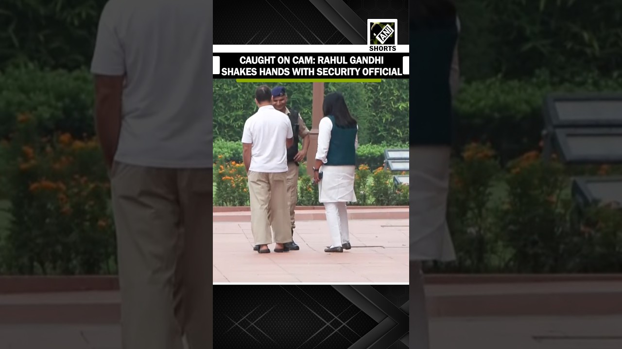 Lok Sabha LoP Rahul Gandhi shakes hands with security official at parliament premises in Delhi