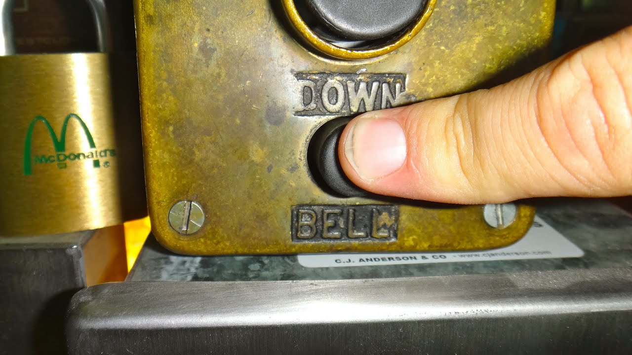 Ringing the elevator alarm in a vintage manually controlled Reading elevator