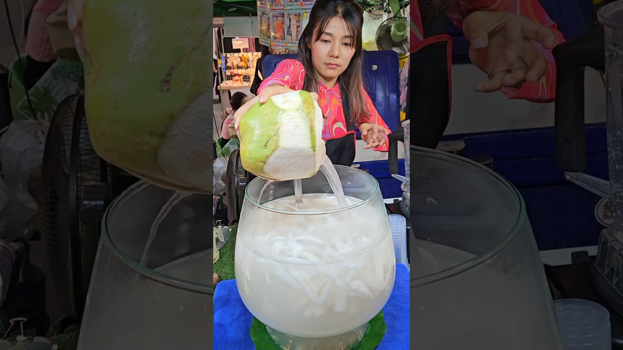 Thai Smiling Angel Selling Fresh Coconut Shakes