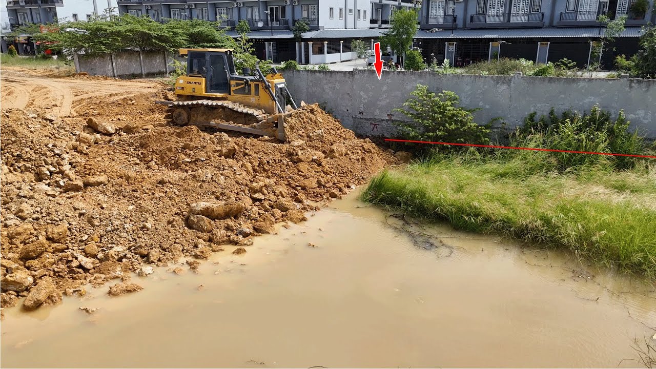 Shantui Bulldozer Pushing and Clearing Soils Filling Land Dump Truck Working