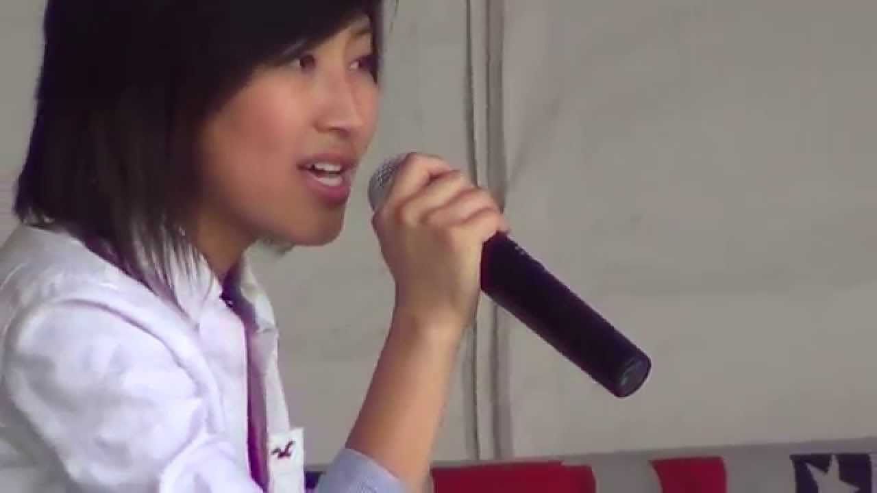 vulkee-021  July 4 2013: Young woman sings 
