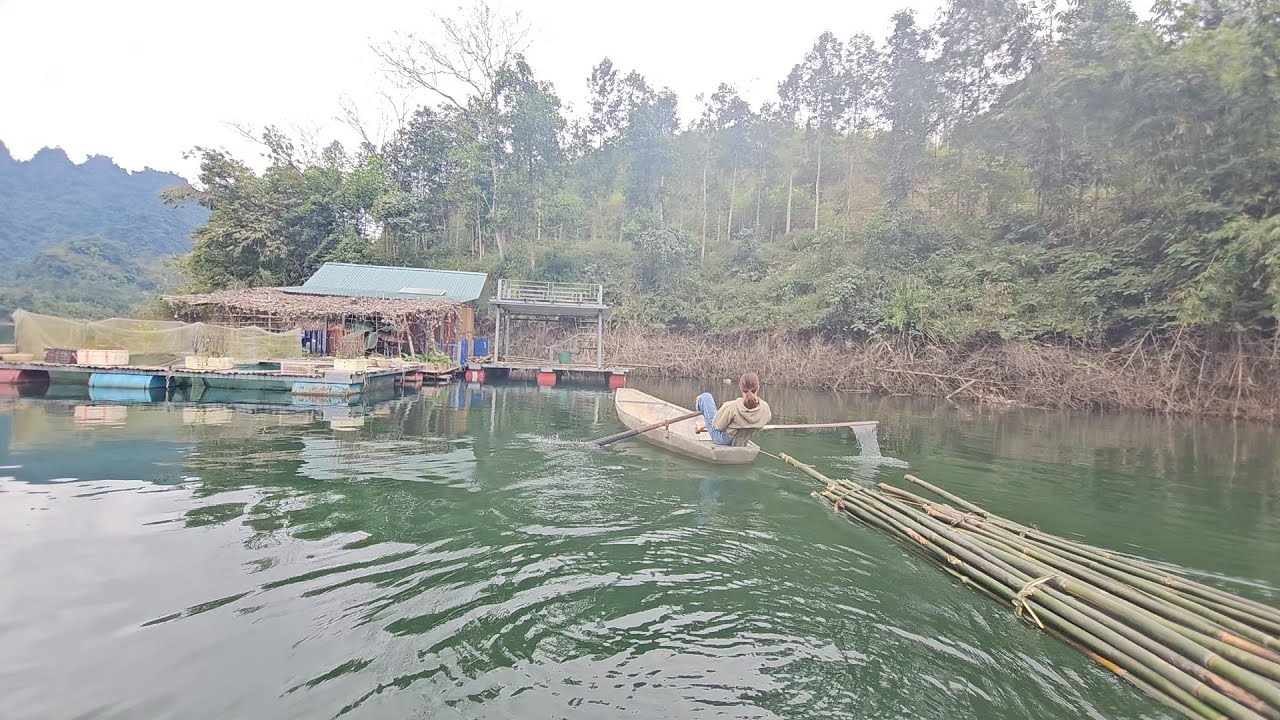 The girl built a bamboo frame for the house floating on the lake.