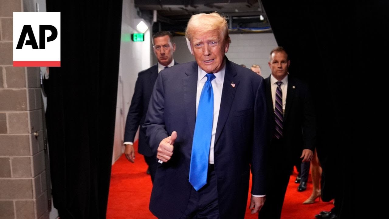 Donald Trump enters the arena on day two of the RNC