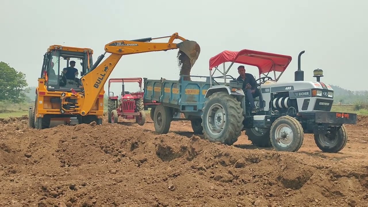 JCB machine working at full capacity to load soil into heavy-duty tractor trolleys