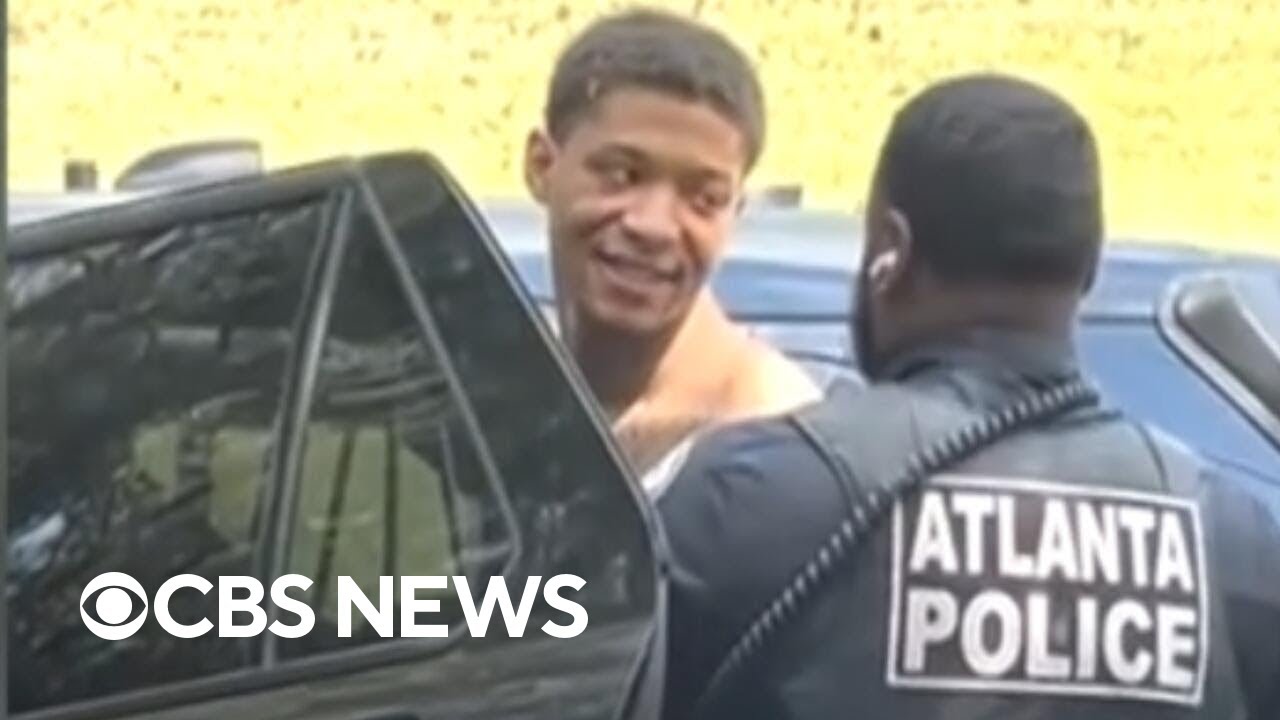 Escaped inmate blew a kiss and smiled as he was detained for fleeing prison