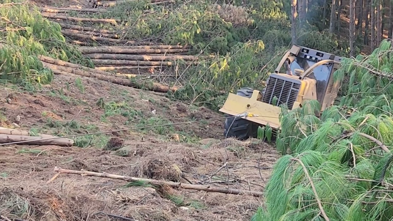Tightline 3021 winch assisting a CAT 525 forestry skidder