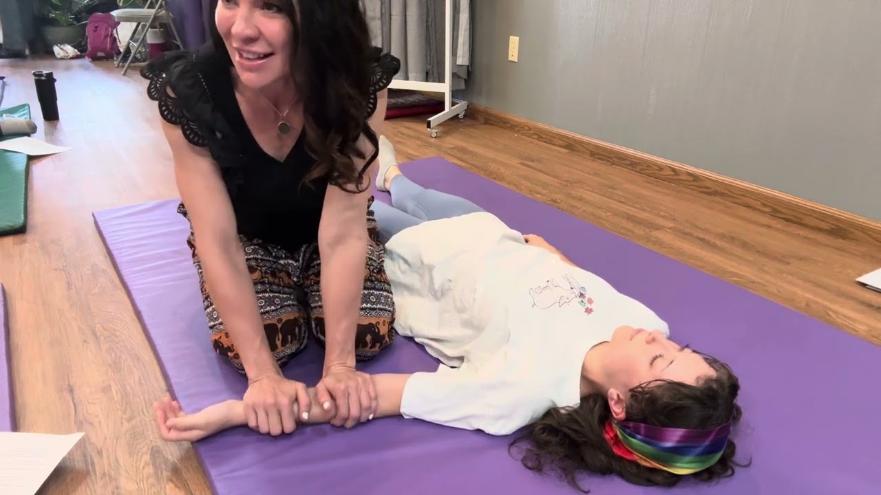Working the arms in Thai Massage
