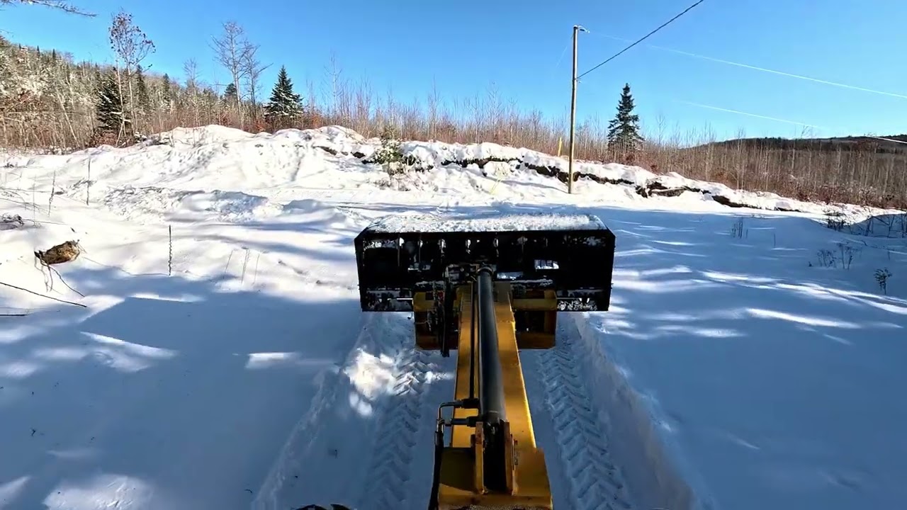 Snowplowing with loader and modified fisher plow with sides.