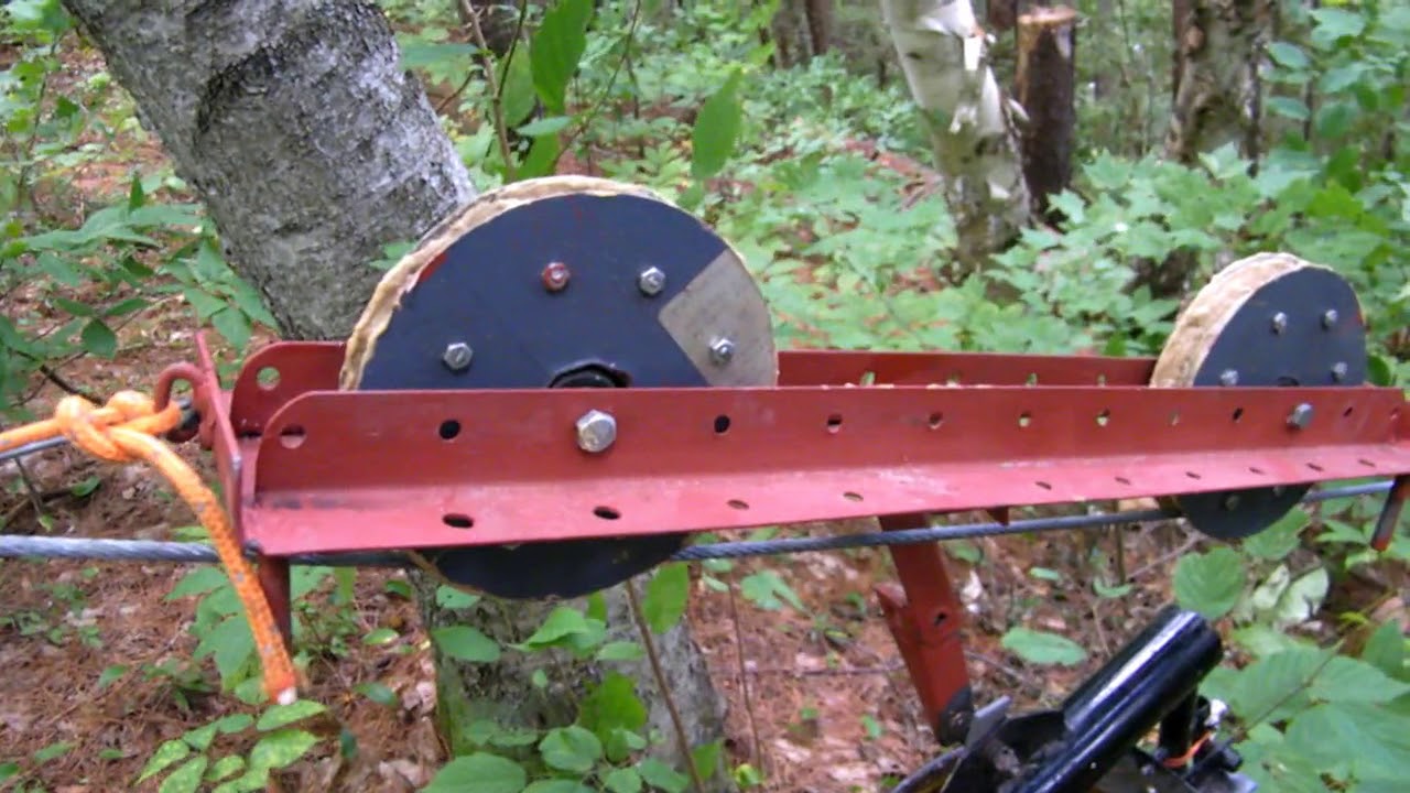 Auto-dumping auto-return zip-line rock bucket