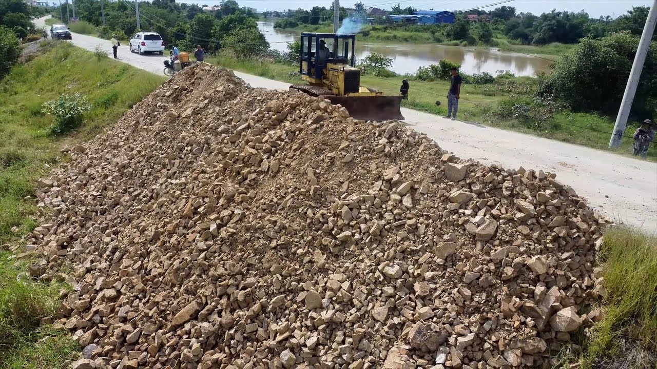Wow! Amazing Landfill Work Use Skilled D31p Dozer Push Stone into Deep Flood Area with 5T Dump Truck