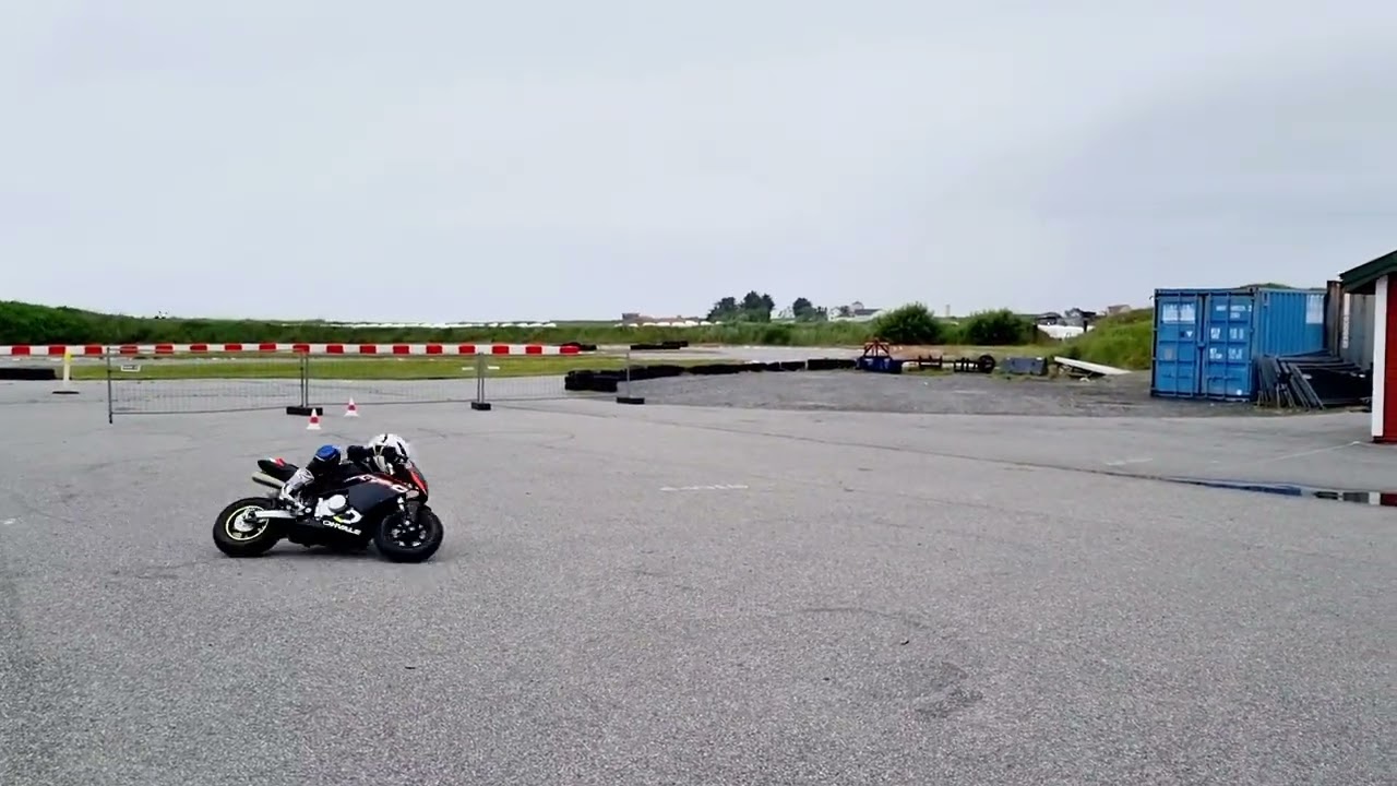 MISSION: Elbow down! Use those elbow sliders! Ohvale 110 Automatic. Pilot 9 years old