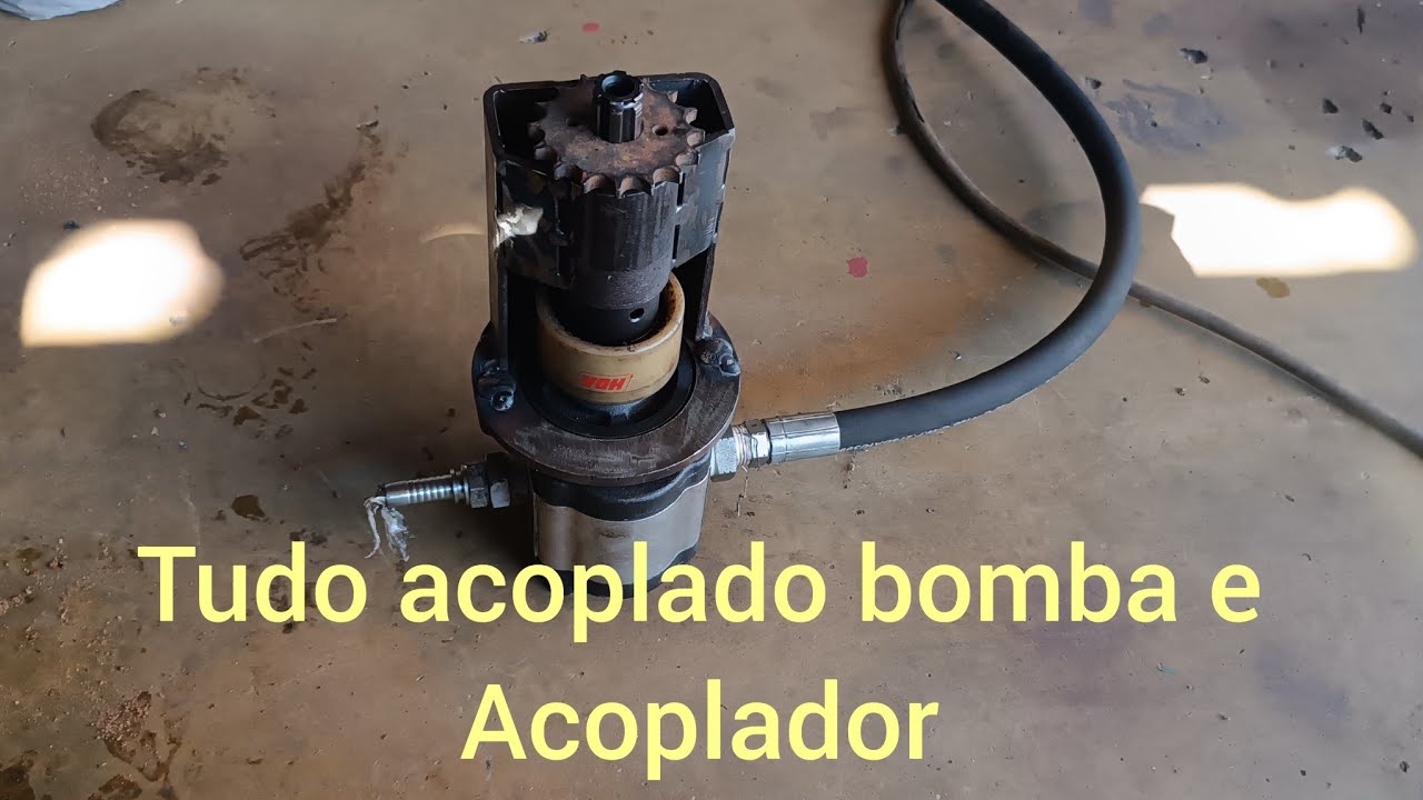 Coloquei o acoplador da bomba hidráulica  do basculante  do Triciclo da granja baixa verde