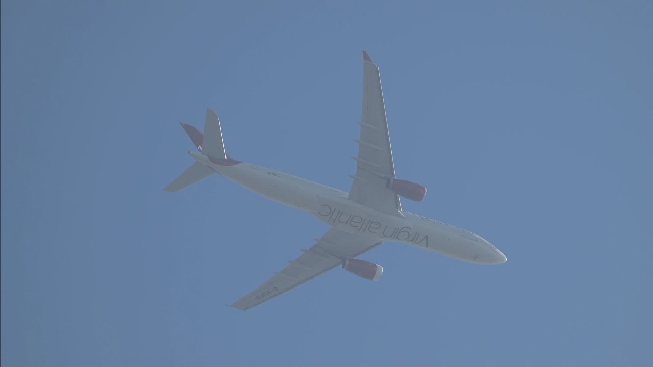 An uncommon sighting of a Virgin Atlantic A330-300 making its way past the hazy sky