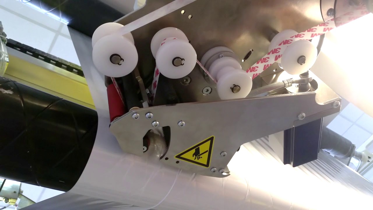 Enimac applicators for integration  - add a tape application function to other machines.