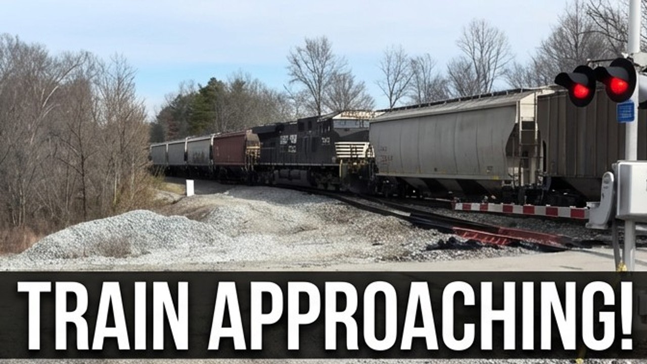 Freight Train vs Car at Railroad Crossing