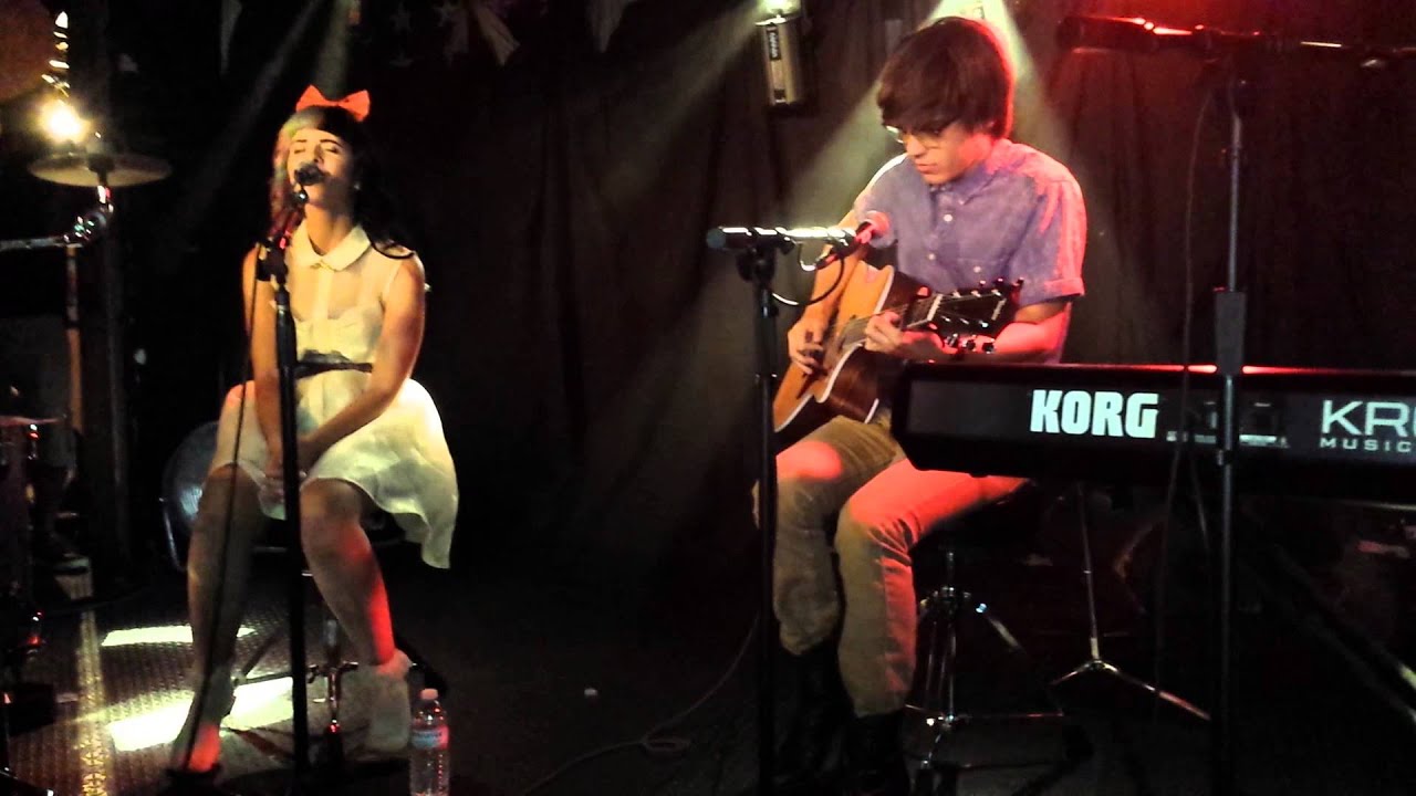 Melanie Martinez and MacKenzie Bourg performing 