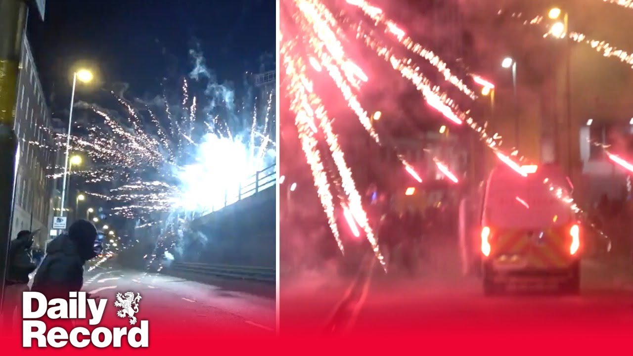 Birmingham turns into a war zone as police and public bombarded with fireworks and flares