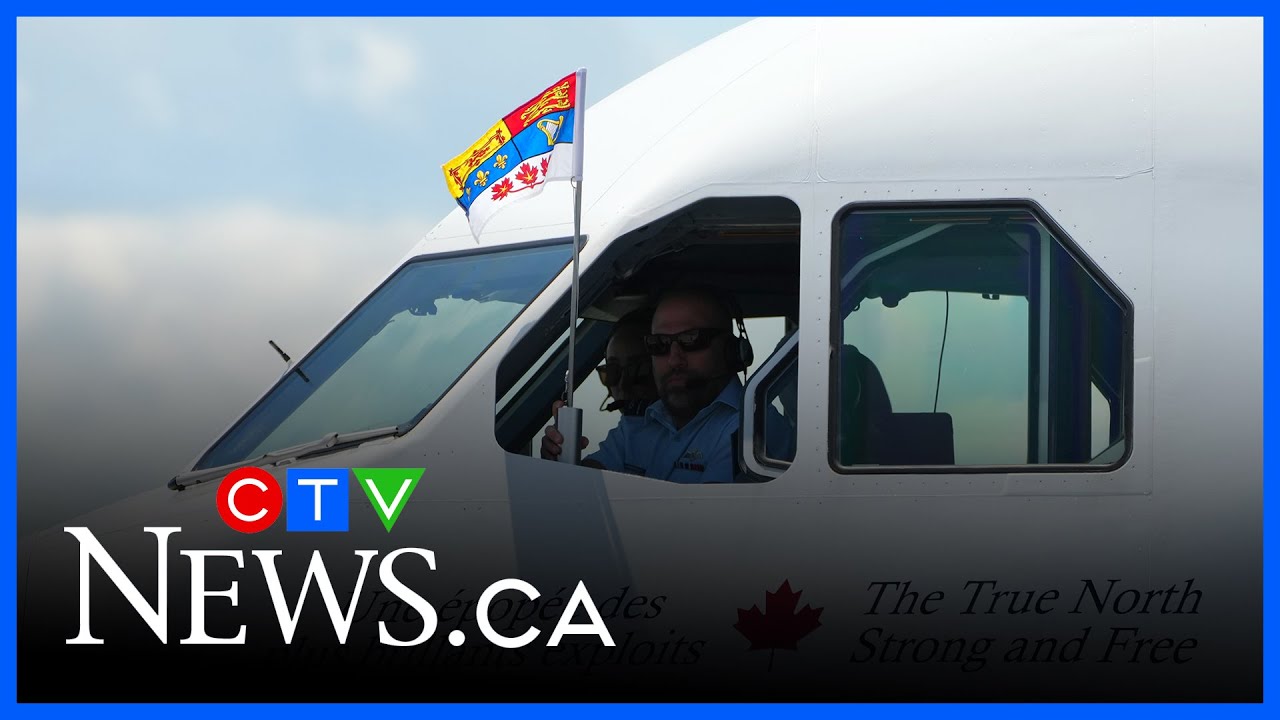 Pilot holds up standard after King Charles and Queen Camilla land in Ottawa