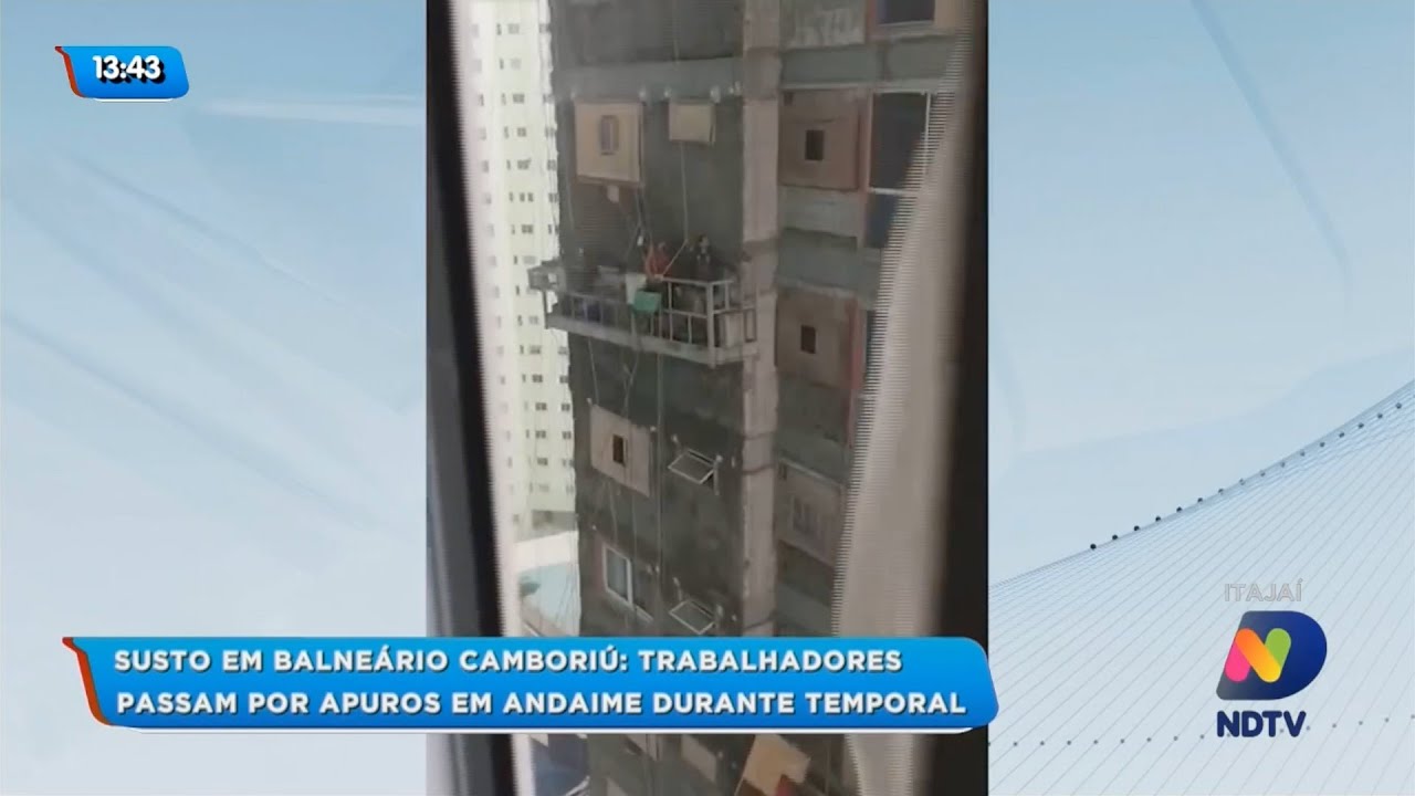 Trabalhadores passam por apuros em andaime durante temporal