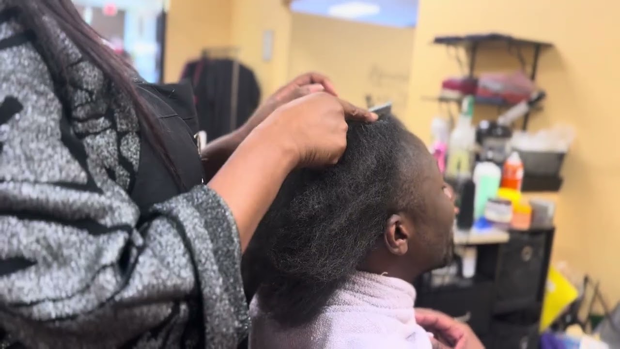 Watch Jello give her client cornrows—flawless from start to finish