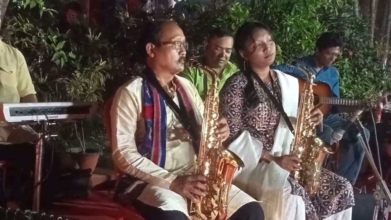 Kailash Rabha with his daughter Juthika Rabha playing saxophone
