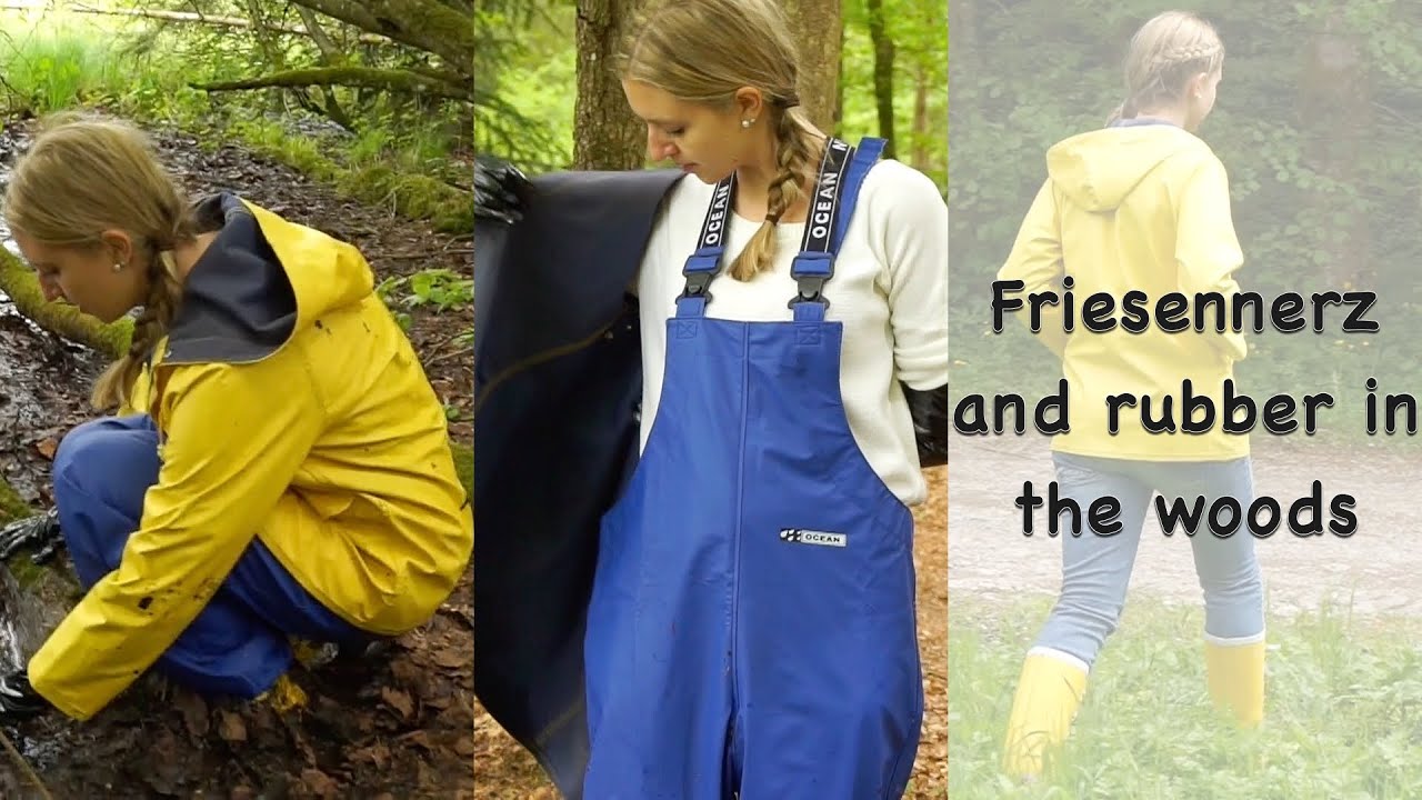 Blonde girl in Friesennerz raincoat, Ocean bib pants, yellow wellies, black vinyl gloves