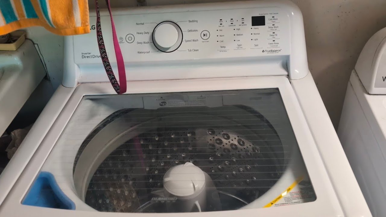 LG WT7000CW top load washer on speed wash washing a small load of whites