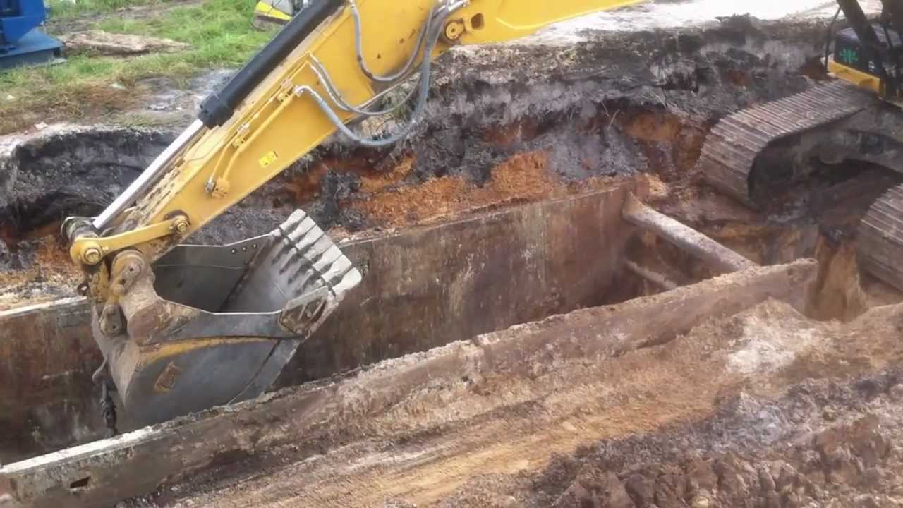 Caterpillar 336E excavator digging for storm pipe