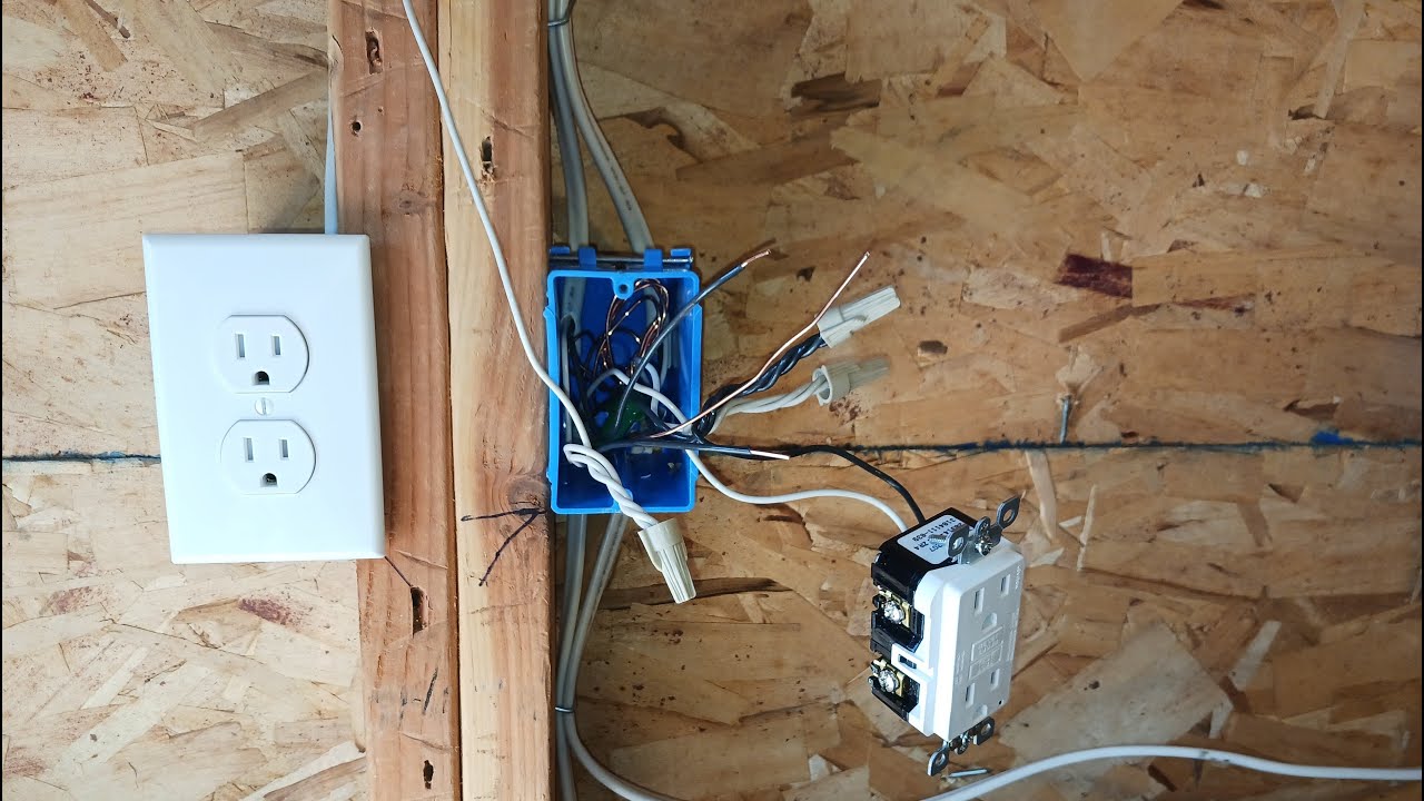 Connecting the wires and GFCI receptacle in the box after adding another GFCI protected cable.