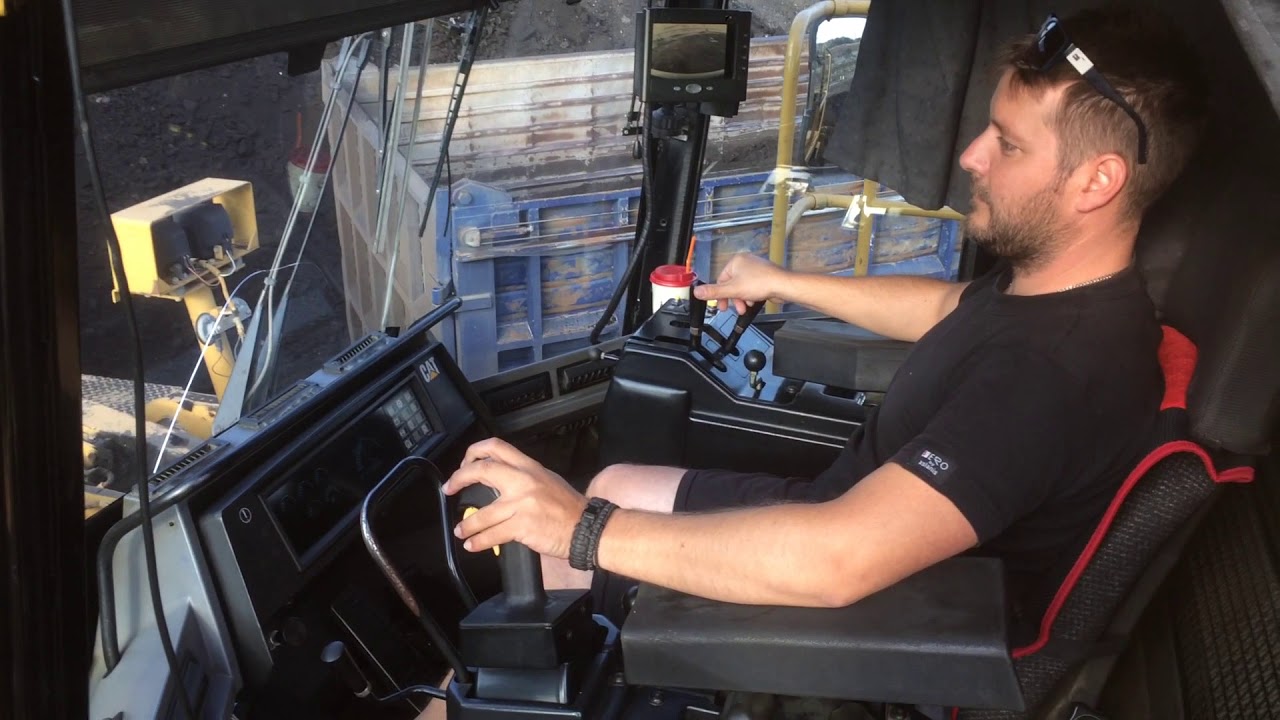 Caterpillar 990 Wheel Loader Loading Coal On Trucks - Operator View
