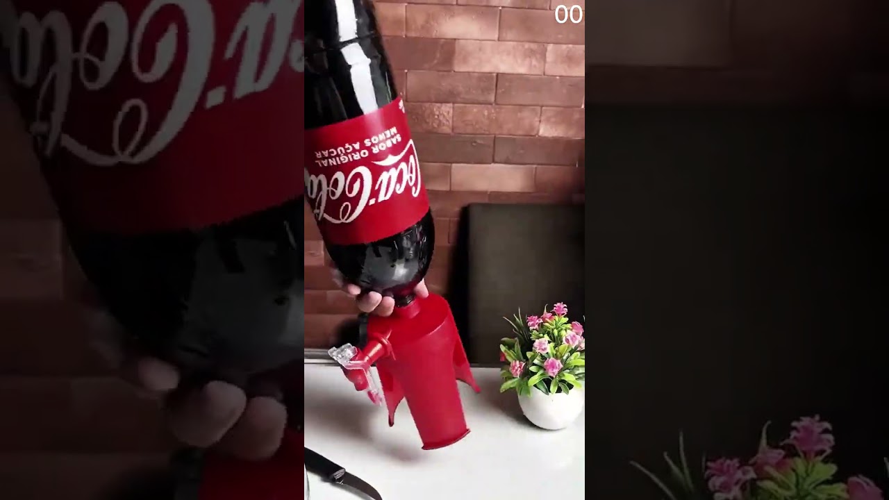 Coca-Cola bottle fitted with red dispenser for easy pouring