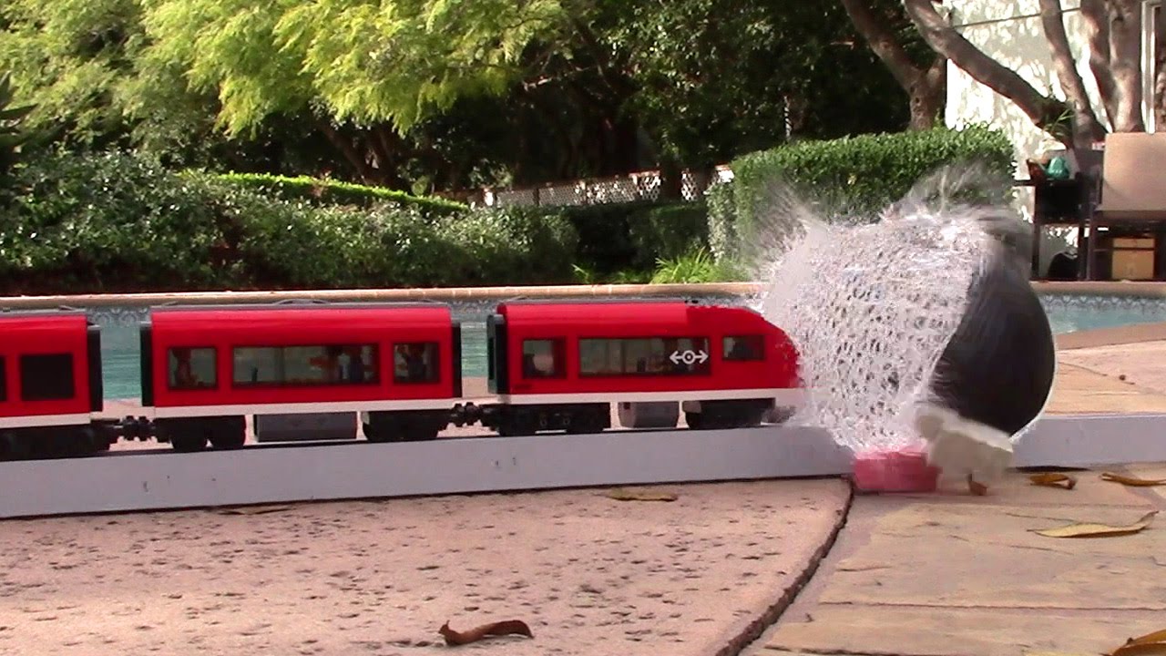Lego trains crashes in to a water balloon