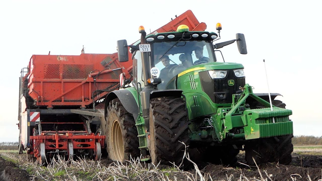 John Deere 6215R harvesting Potatoes in wet & muddy conditions w/ Dewulf RQ2060 2-row Harvester