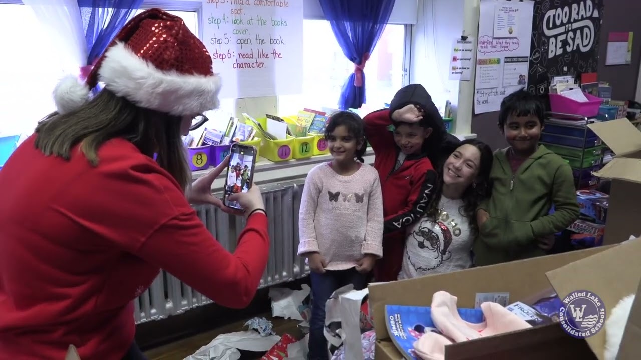 Walled Lake Northern delivers gifts to Dickinson East Elementary in Hamtramck