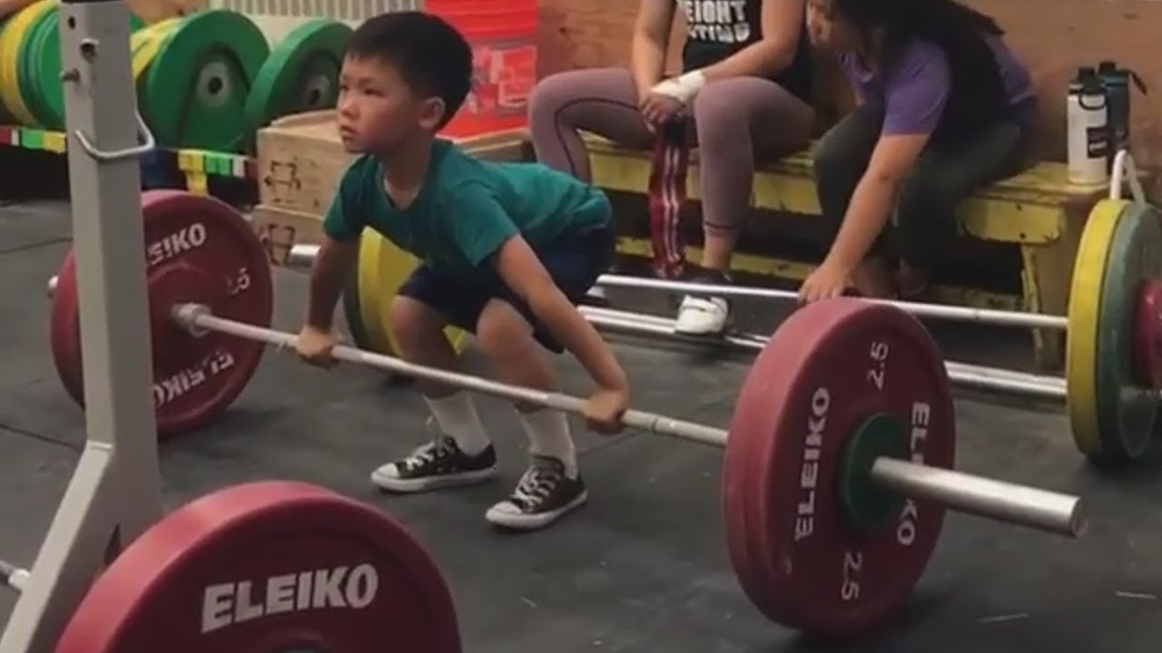 Kids do olympic weightlifting