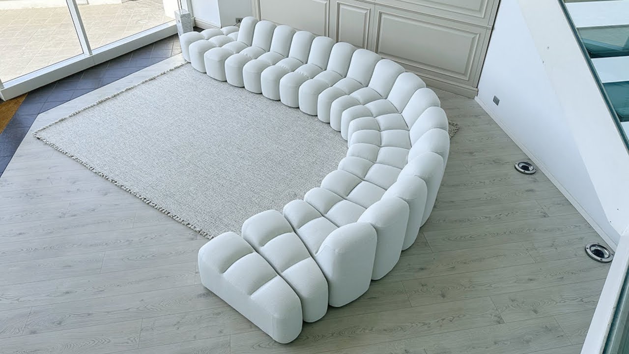 Array White Sofa by Sn&oslash;hetta | MDF Italia Snake Sofa Displayed in a Modern Setting