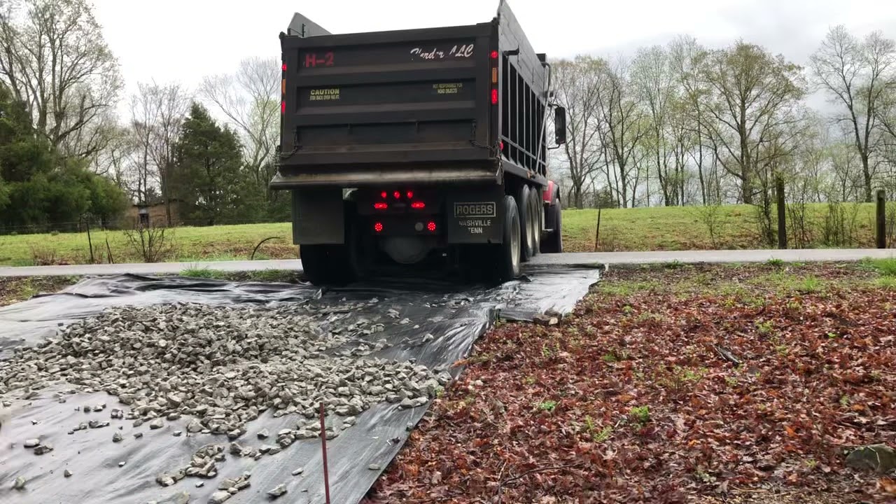 Dump truck getting stuck making the driveway