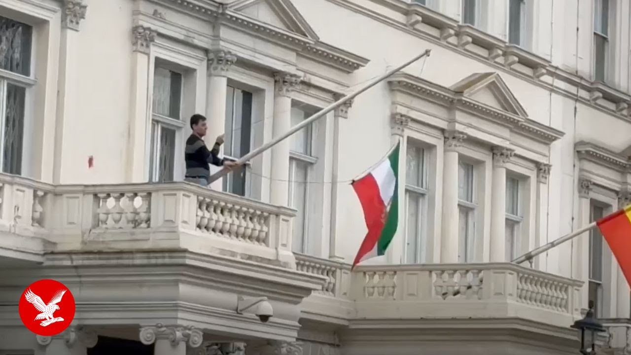 Protester tears down Iranian flag from London embassy