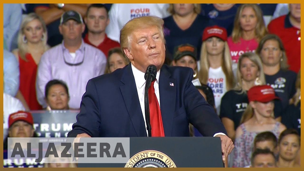 Crowd chants 'send her back' as Trump renews attacks on Omar
