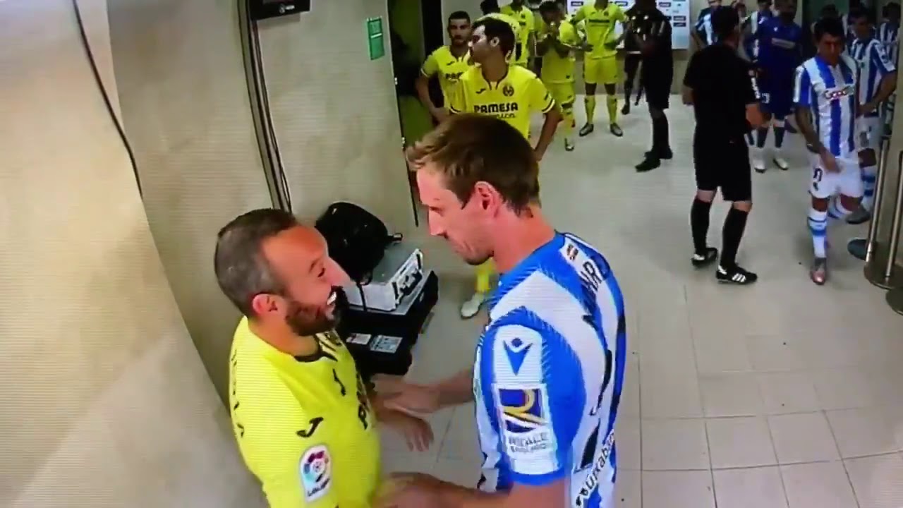 Santi Cazorla & Nacho Monreal embrace before Villarreal vs Real Sociedad