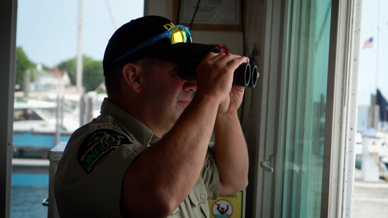 Helping boat captains dock at Mackinac Island State Harbor