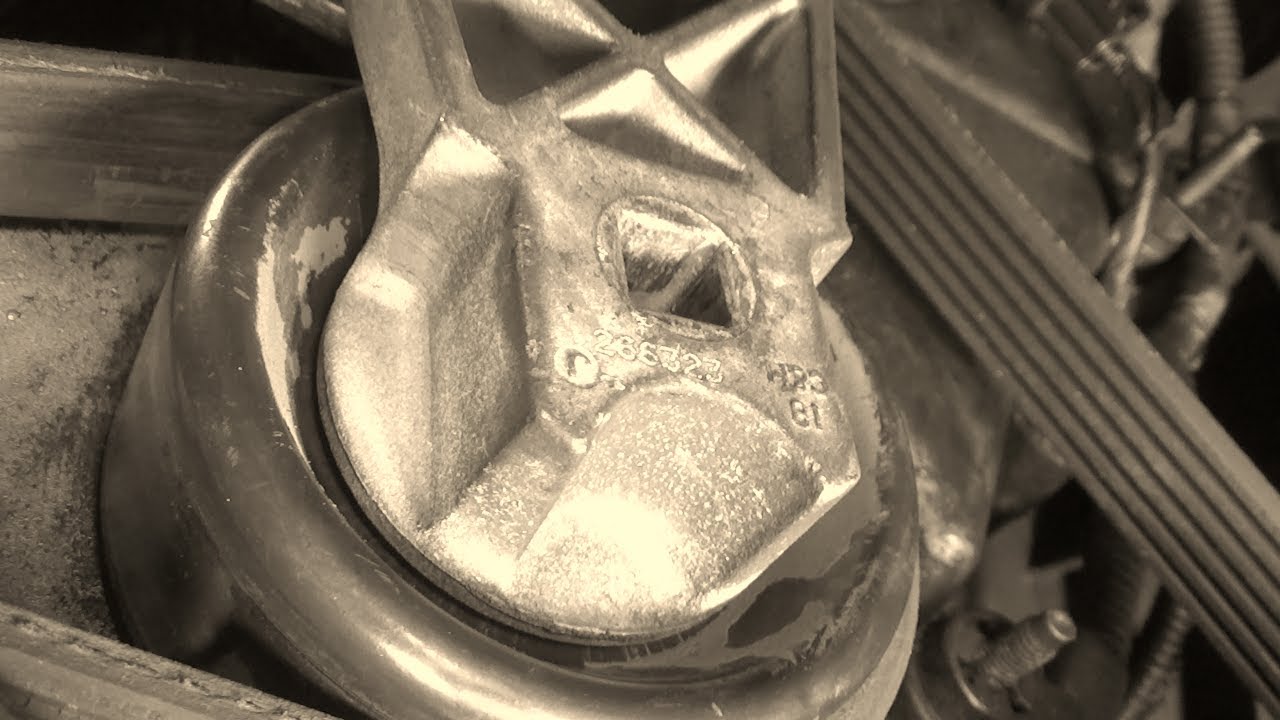 Serpentine belt tensioner pulley removal & installation (2001-2004 Ford Escape)