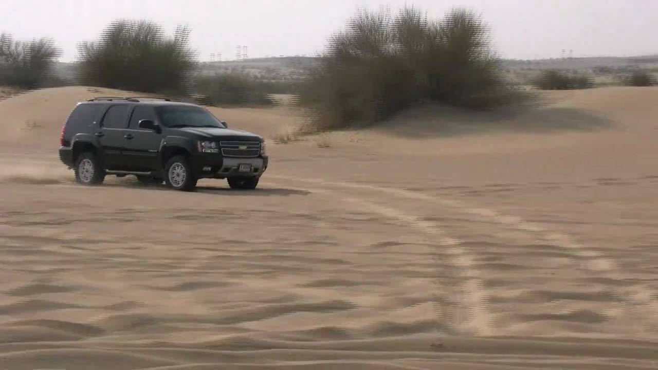 Tahoe Z71 and FJ cruiser in dubai Sand having Fun (Stock)