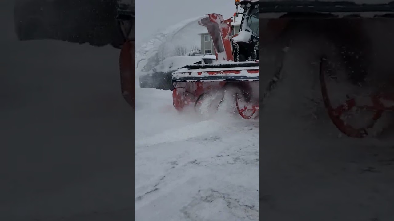 Tractor Snow Blower Steel Augers Removing Snow (Close-up)