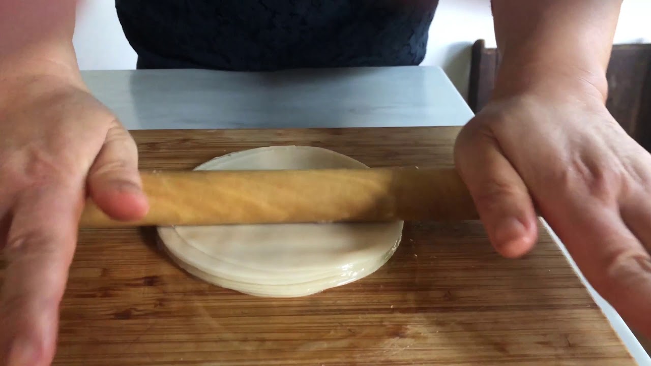 Rolling Dumpling Wrappers Into Mandarin Pancakes