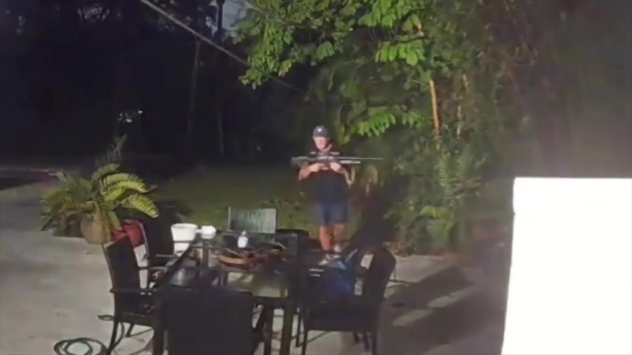 Man accused of terrorizing neighbor arrested; video shows suspect carrying gun in victim’s backyard