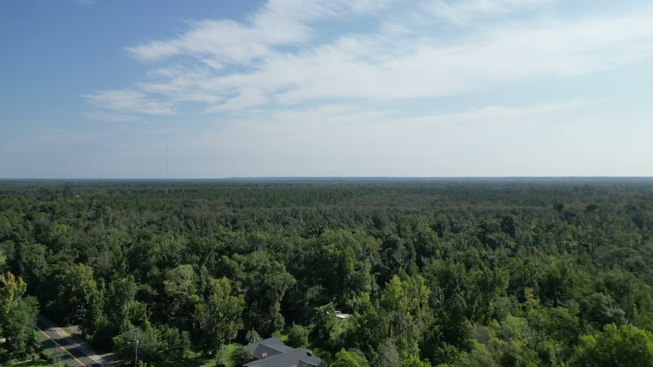 Drone shot of city from across mcdonals