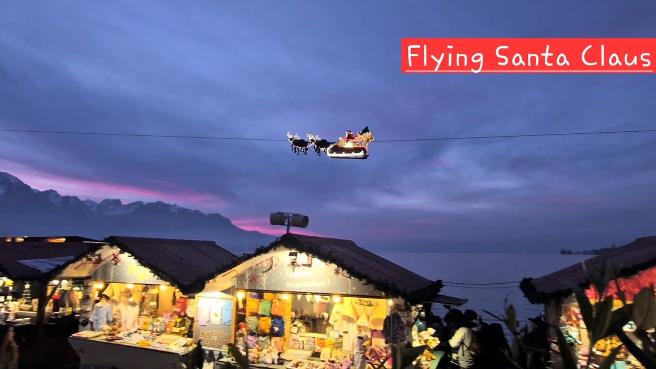 The flying Santa Claus of Montreux on his way into the sunset of the Swiss Alps @montreuxnoel