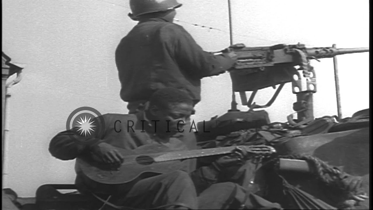US soldiers fire machine guns and German children stand near a tank as machine gu...HD Stock Footage